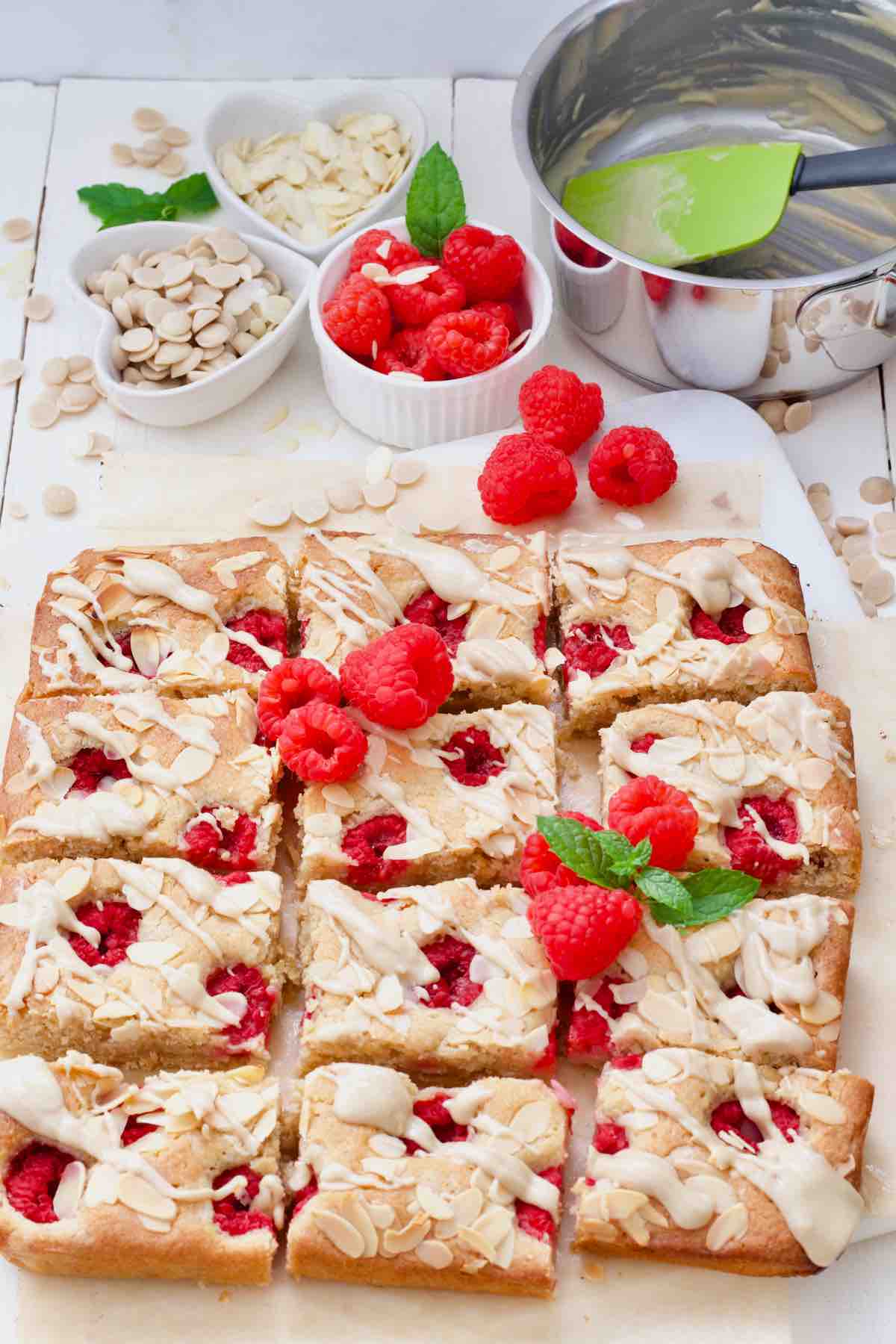 White chocolate and raspberry blondies sliced and decorated.