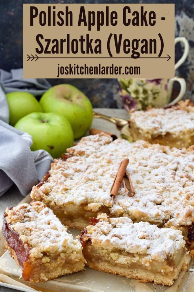 Polish apple cake decorated with cinnamon sticks and with couple of slices cut.