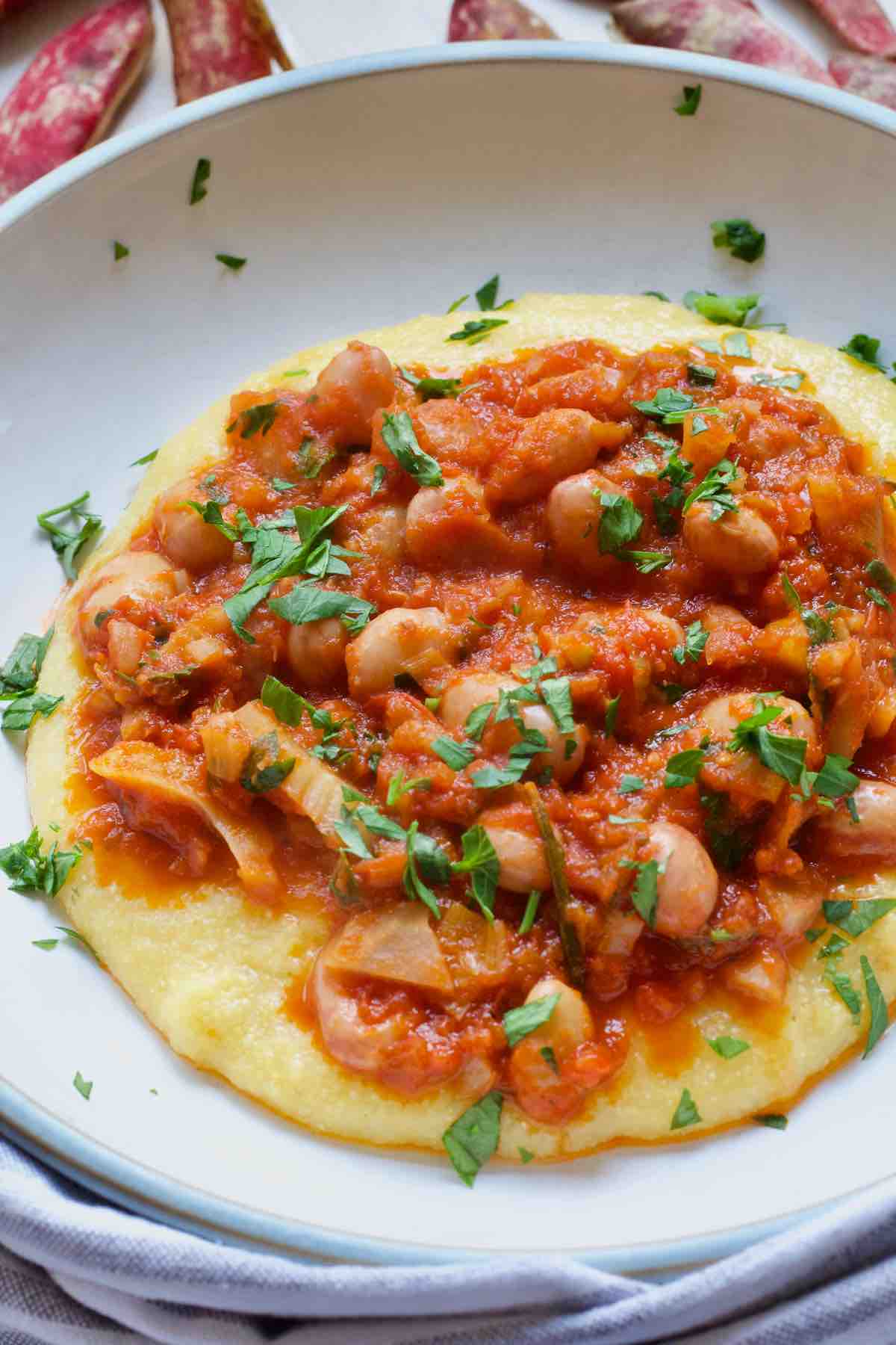 Beans in tomato sauce over creamy polenta.