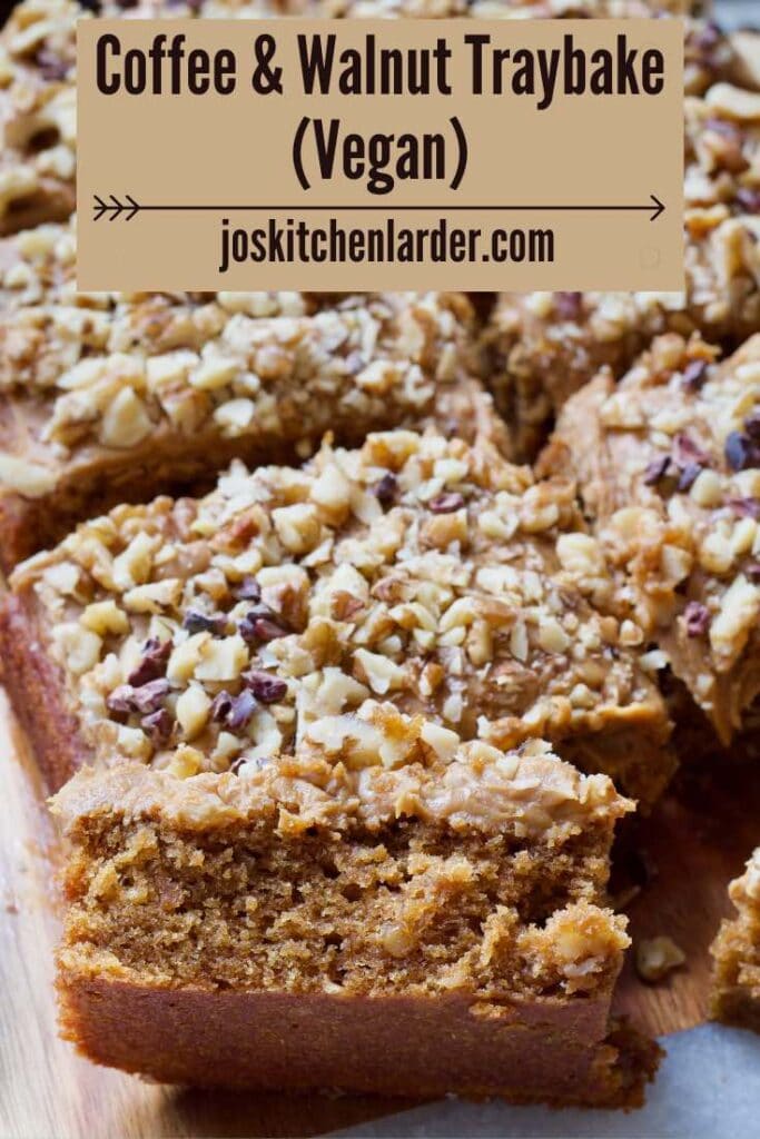 Slice of coffee and walnut traybake on its side showing the crumb.