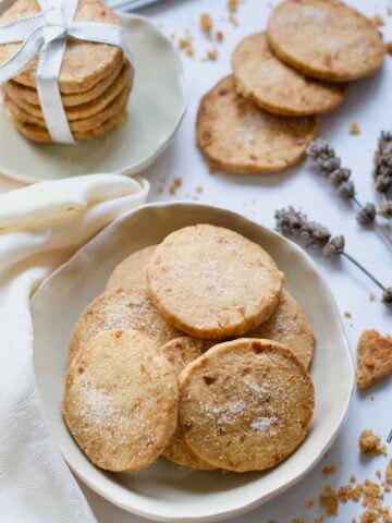 Close up of ginger shortbread biscuits in a bowl.
