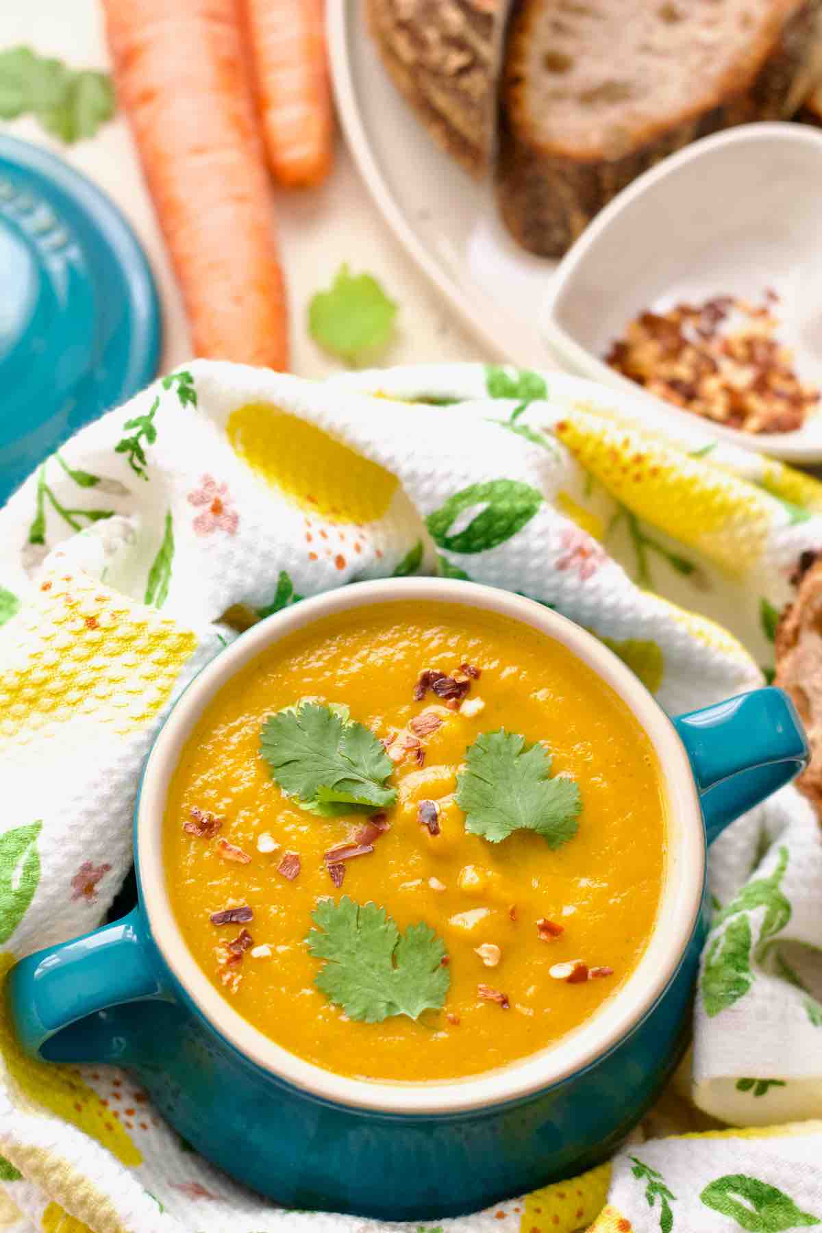 Close up of bowl with carrot and coriander soup.