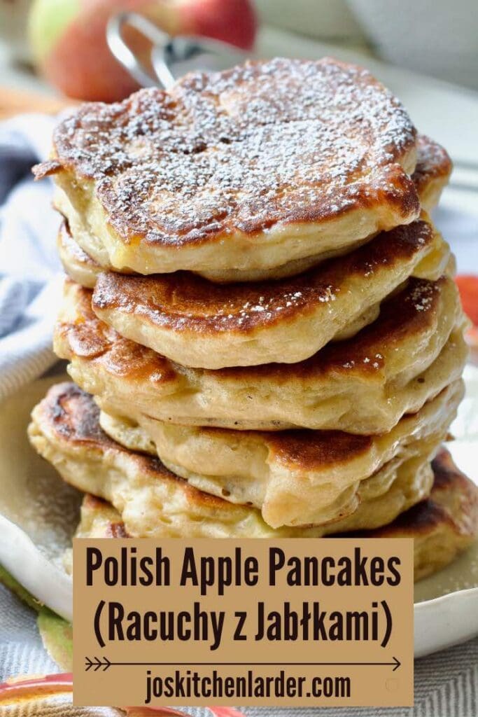 Stack of pancakes on a plate, top one dusted with icing sugar.