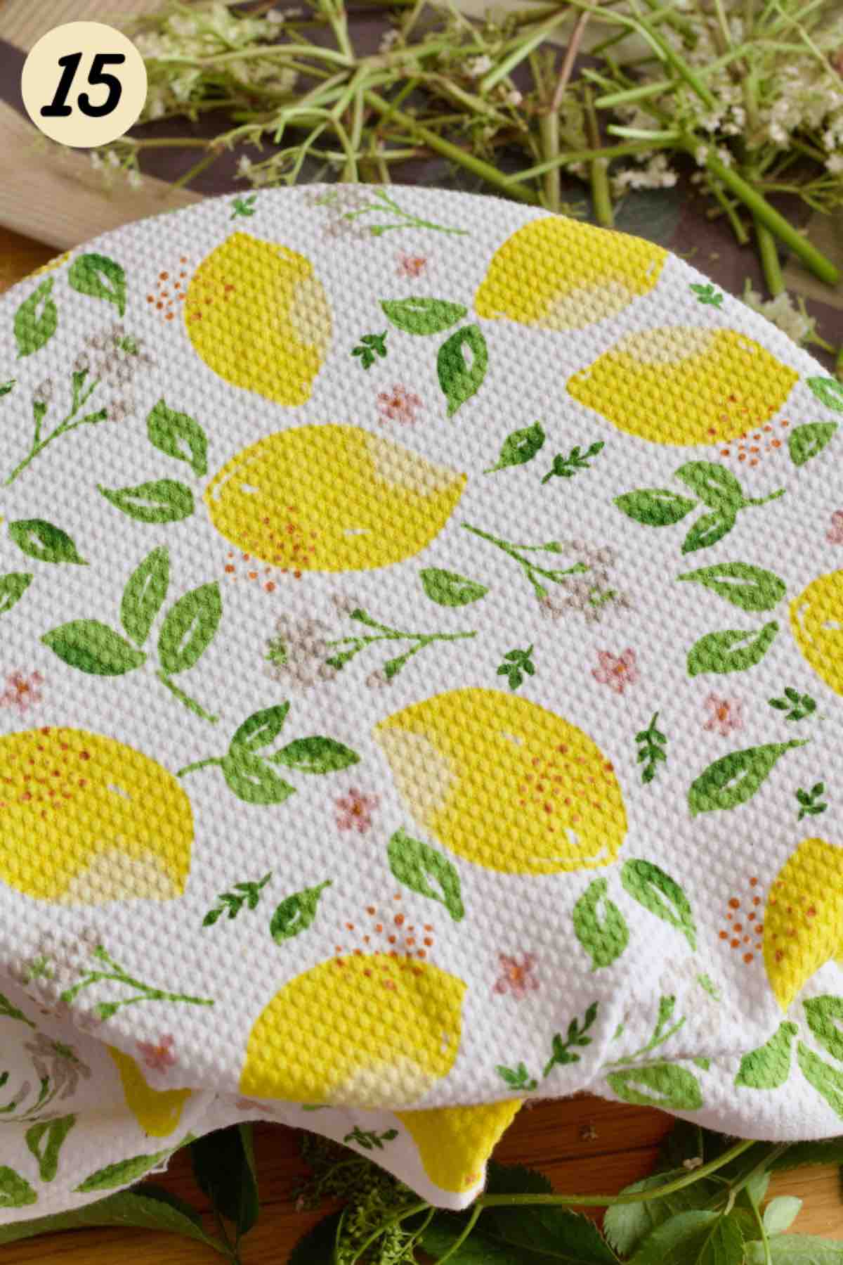 Bowl covered with decorative tea towel.