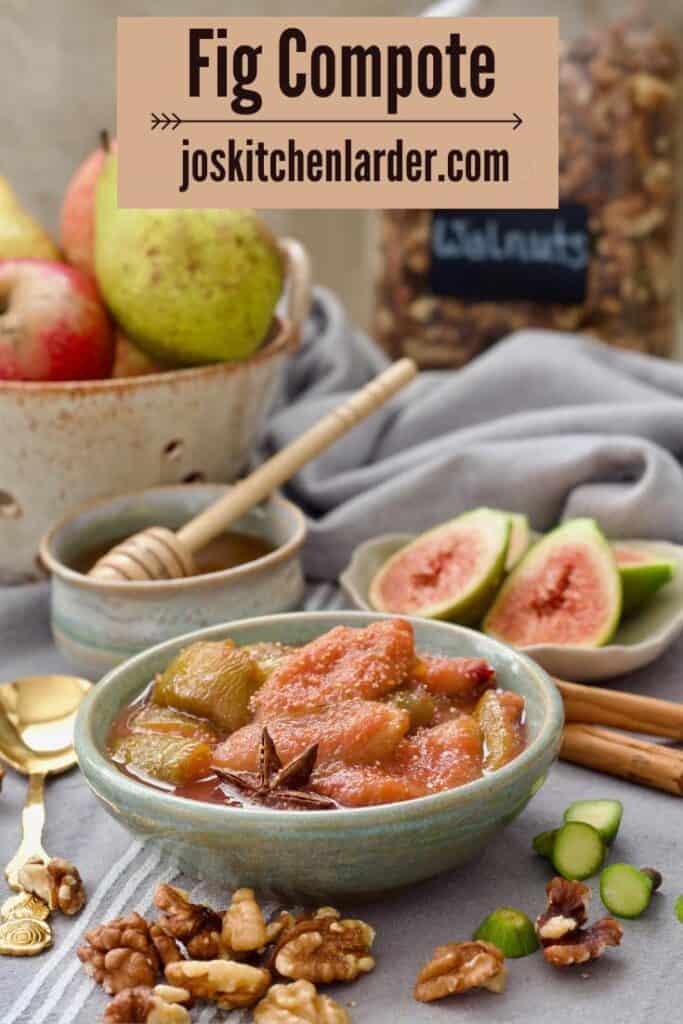 Fig compote in a bowl, fig halves, honey, fruits and nuts around it.