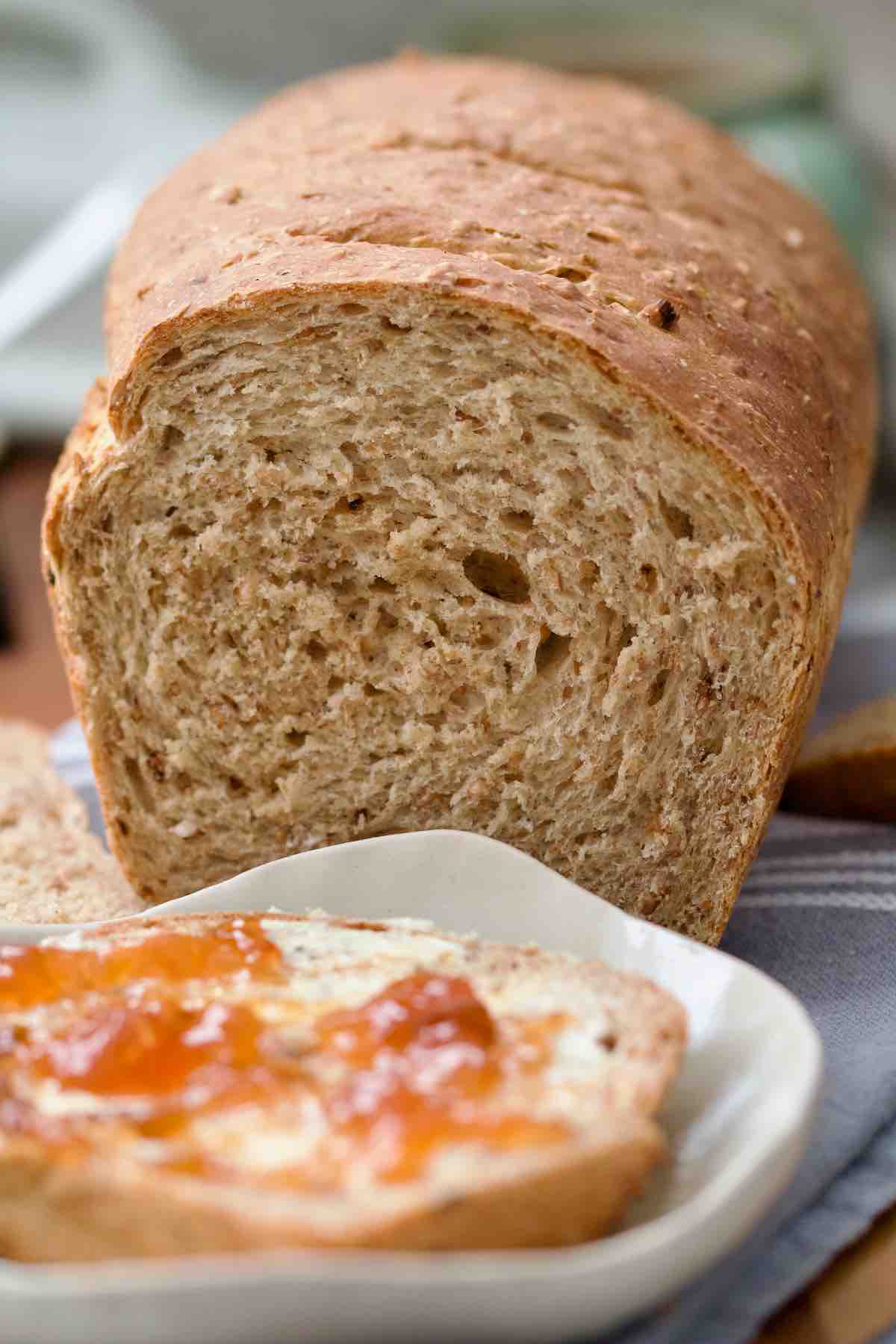 Close up of granary bread loaf showing its crumb.