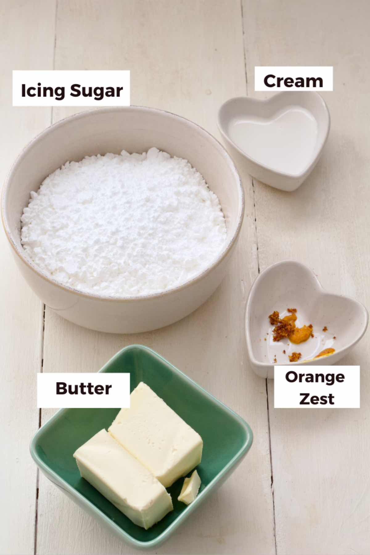 Ingredients for making orange buttercream icing.