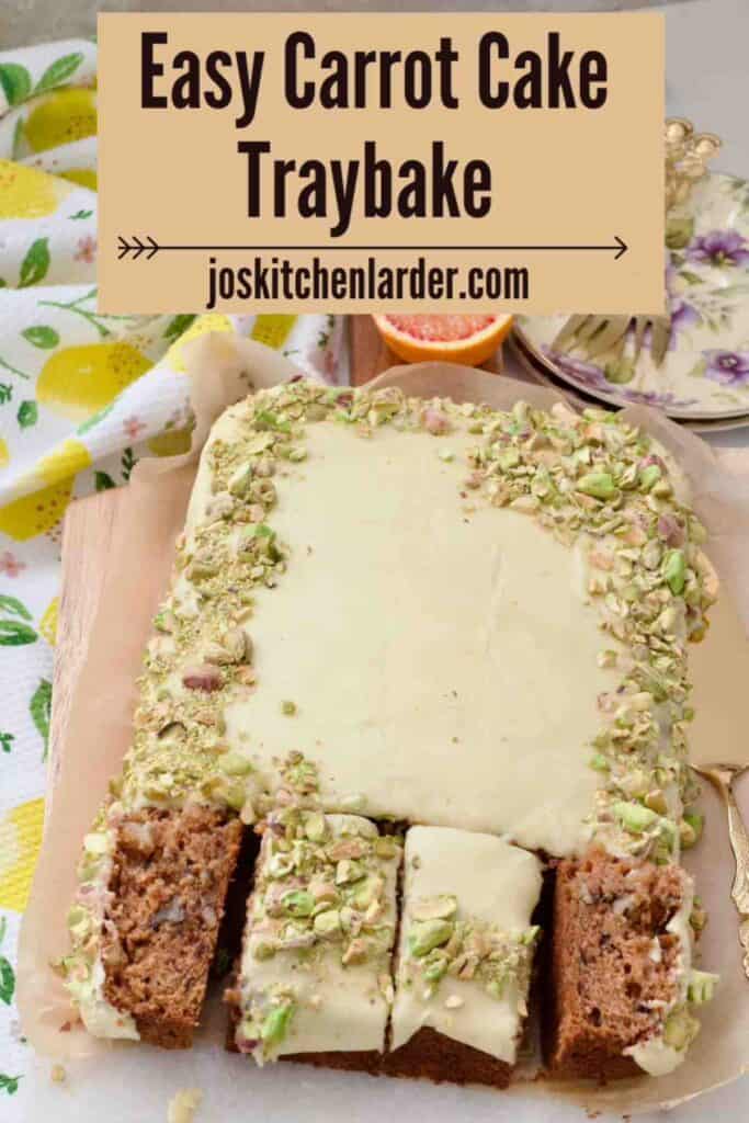 Decorated carrot cake traybake with 4 portions cut, 2 on their sides.