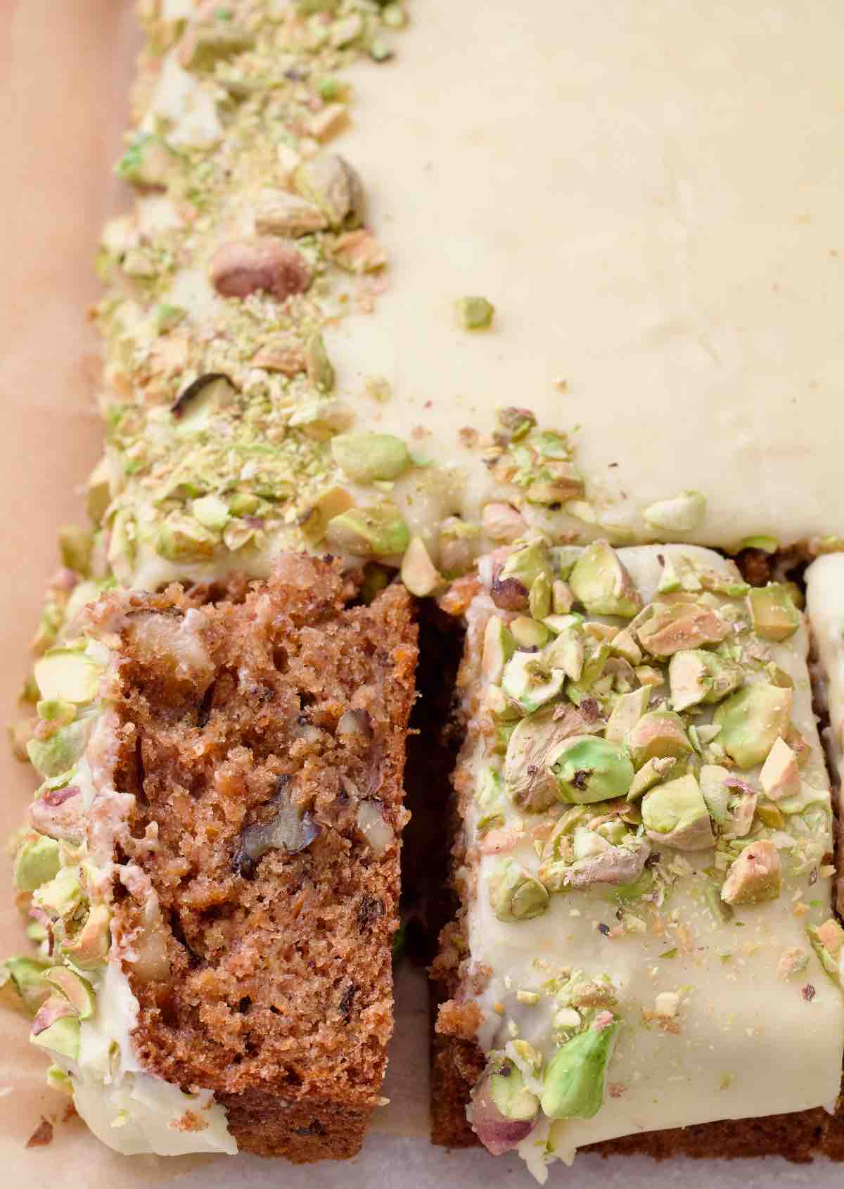 Close up of two slices of carrot cake, one on its side.