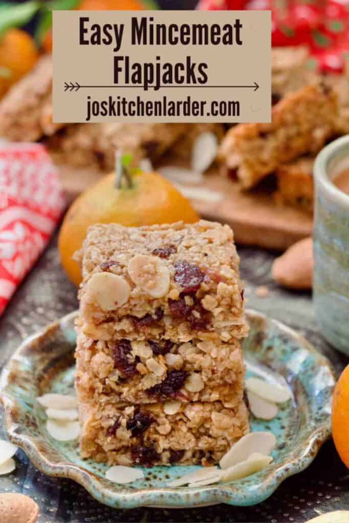 Three mincemeat flapjacks piled up on a small plate.