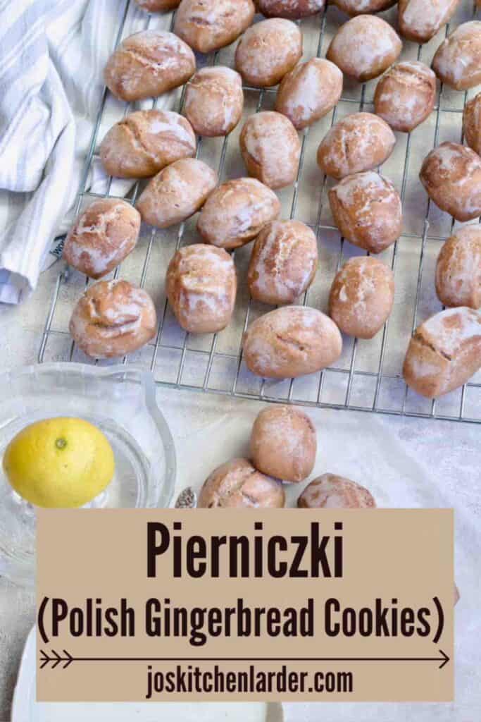 Iced pierniczki, icing, lemon on a glass juicer.