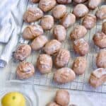 Close up of iced pierniczki spread out on a cooling rack.