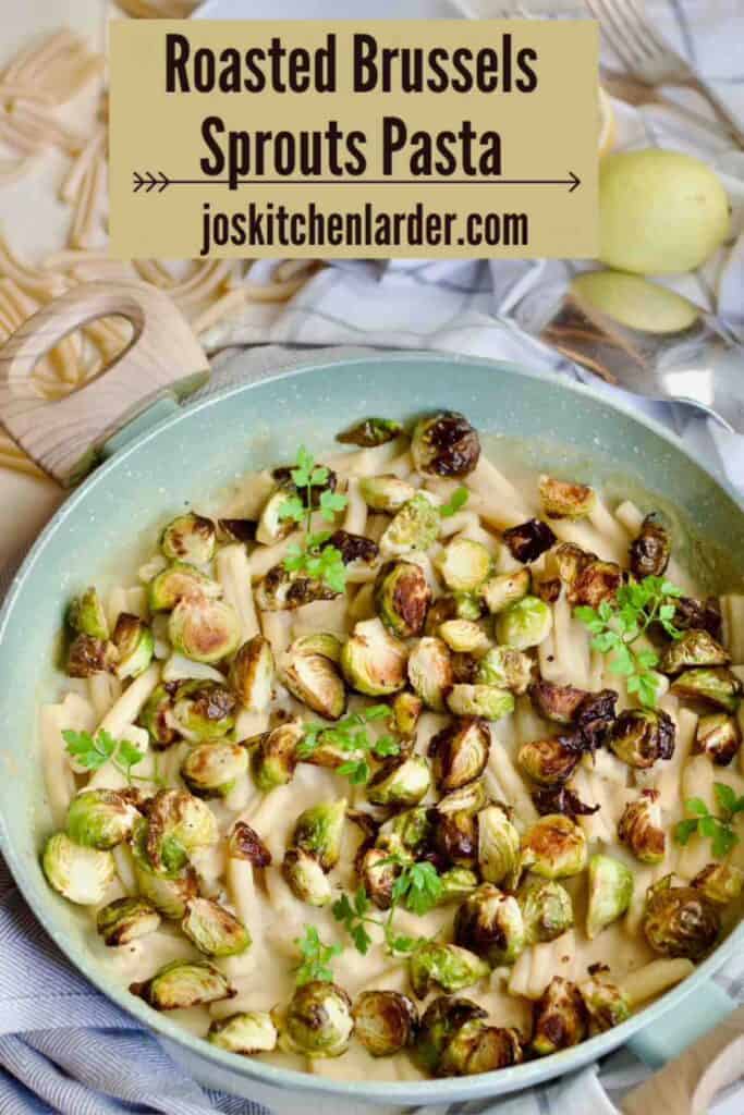 Roasted Brussels sprouts pasta in a pan garnished with fresh parsley leaves.