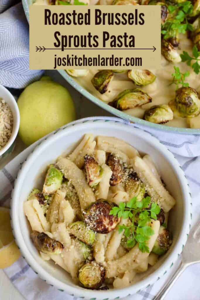 Small bowl filled with creamy pasta with roasted Brussels sprouts and parsley.