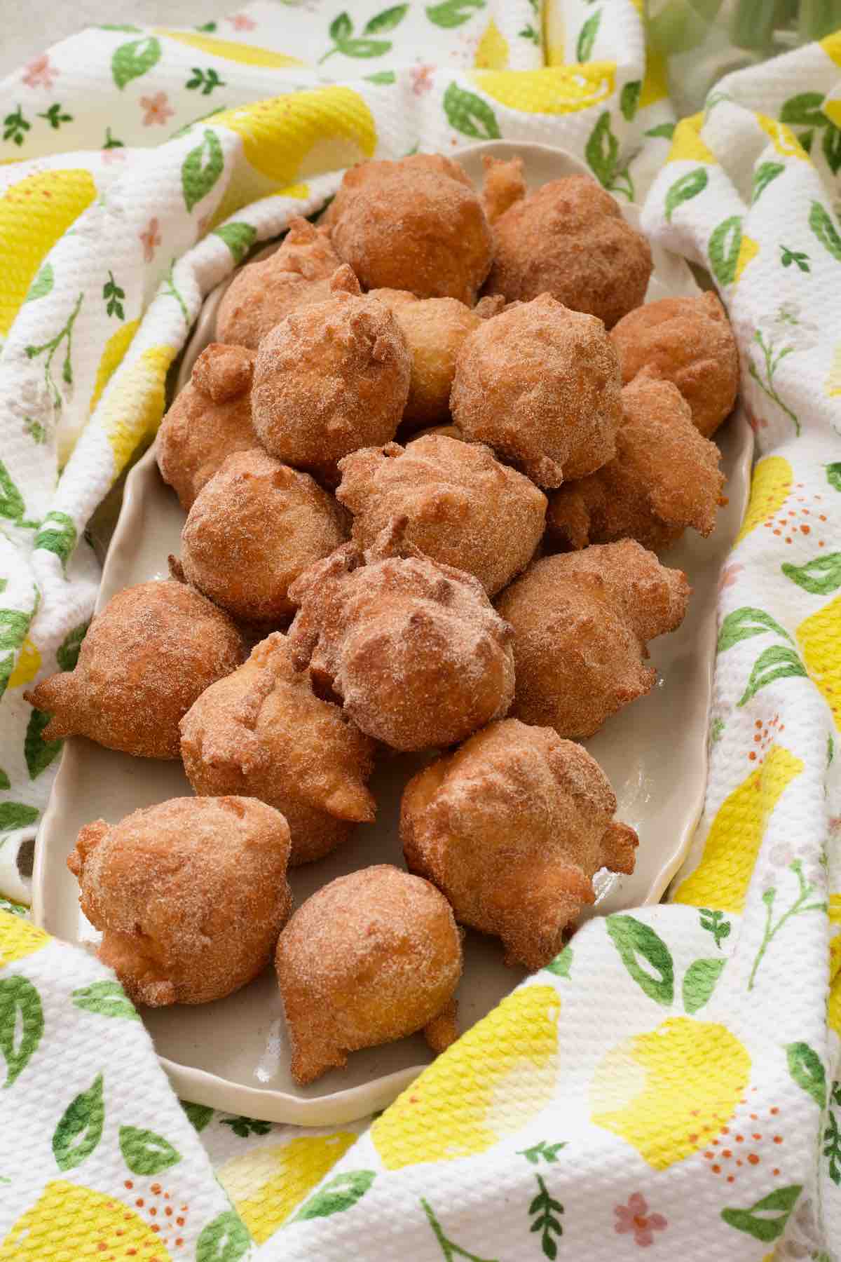 Long platter with mini yogurt doughnuts rolled in cinnamon sugar.