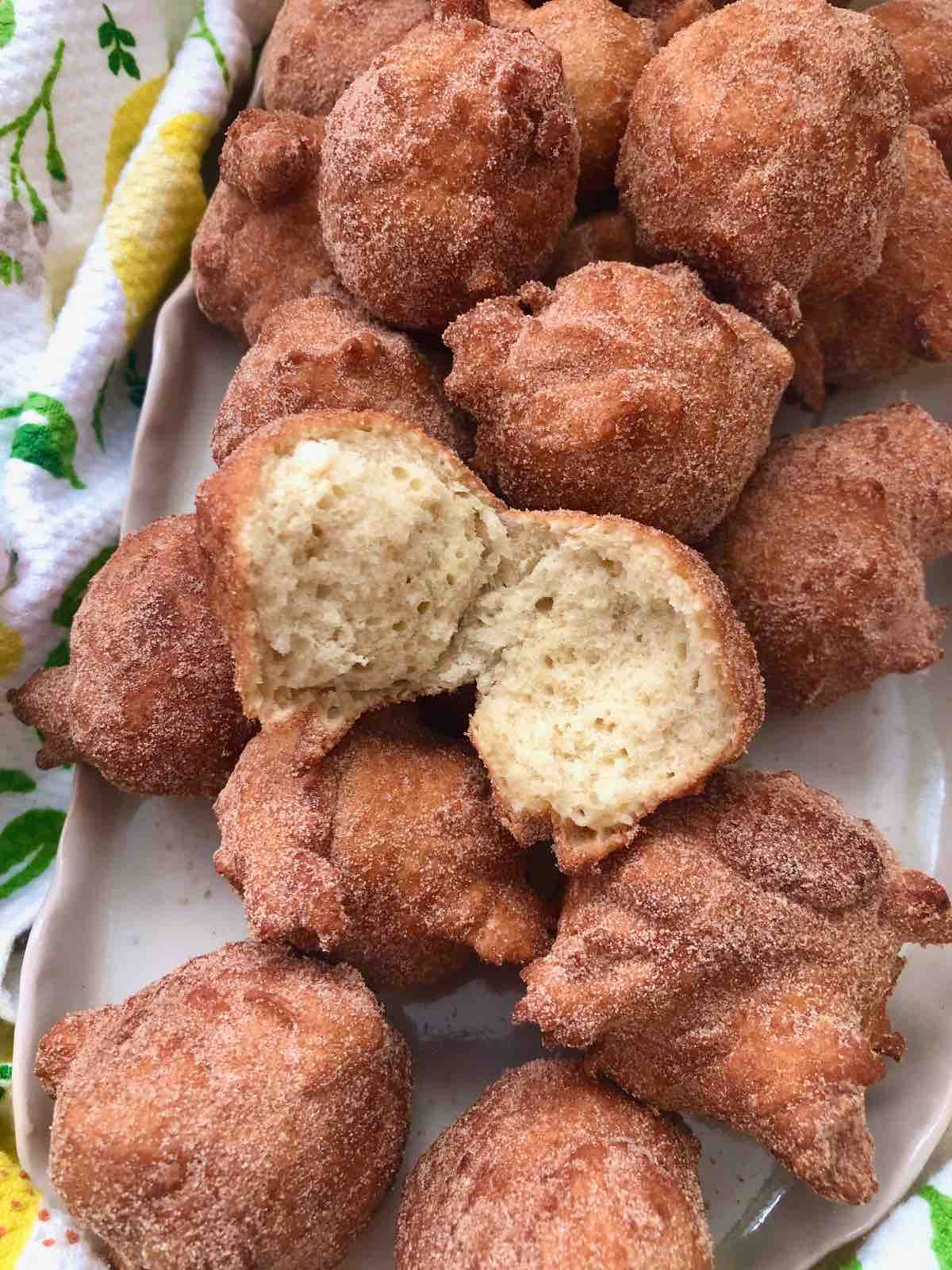 Platter with doughnuts, one cut in half.