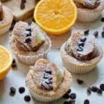 Close up of three chocolate orange butterfly cakes - square.
