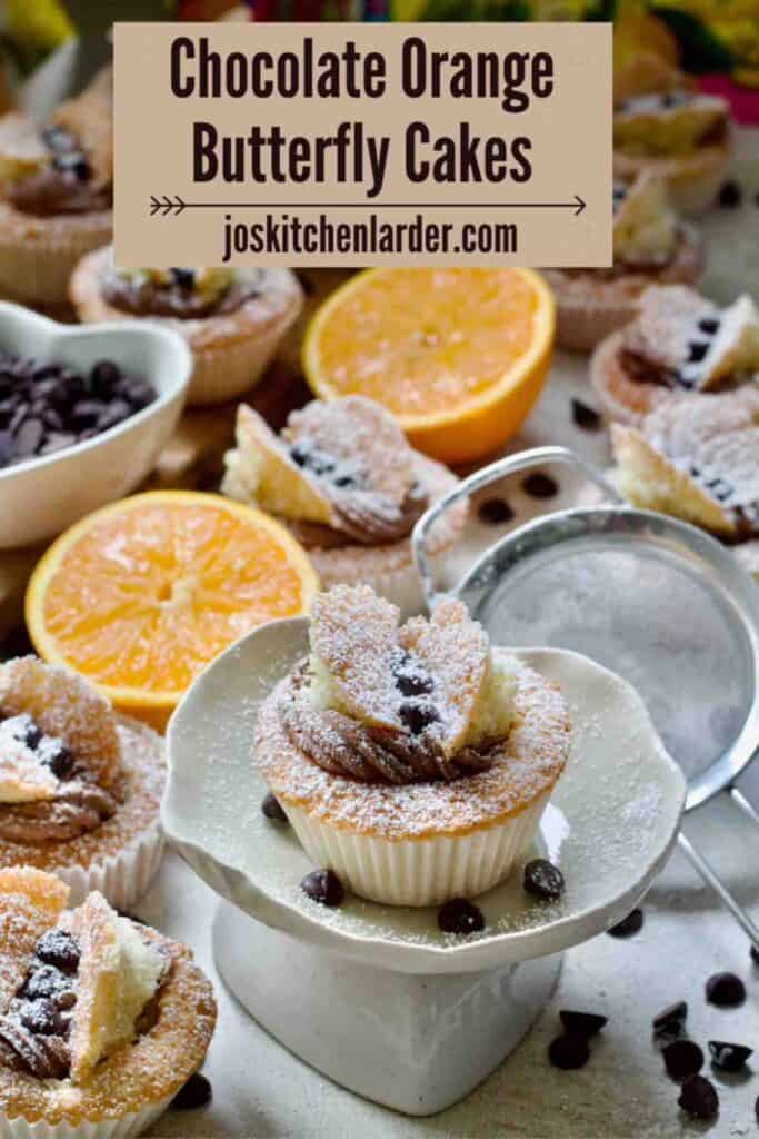 Decorated butterfly cake on a small cake stand.