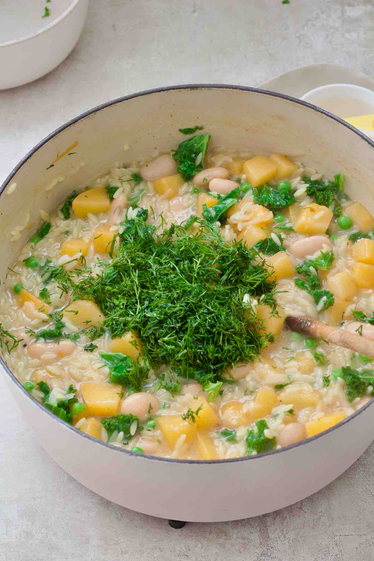 Chopped dill on top of cooked orzo before stirring in.