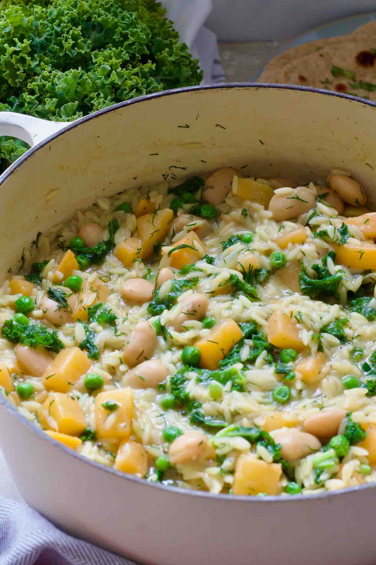 Pot with creamy braised swede orzo.