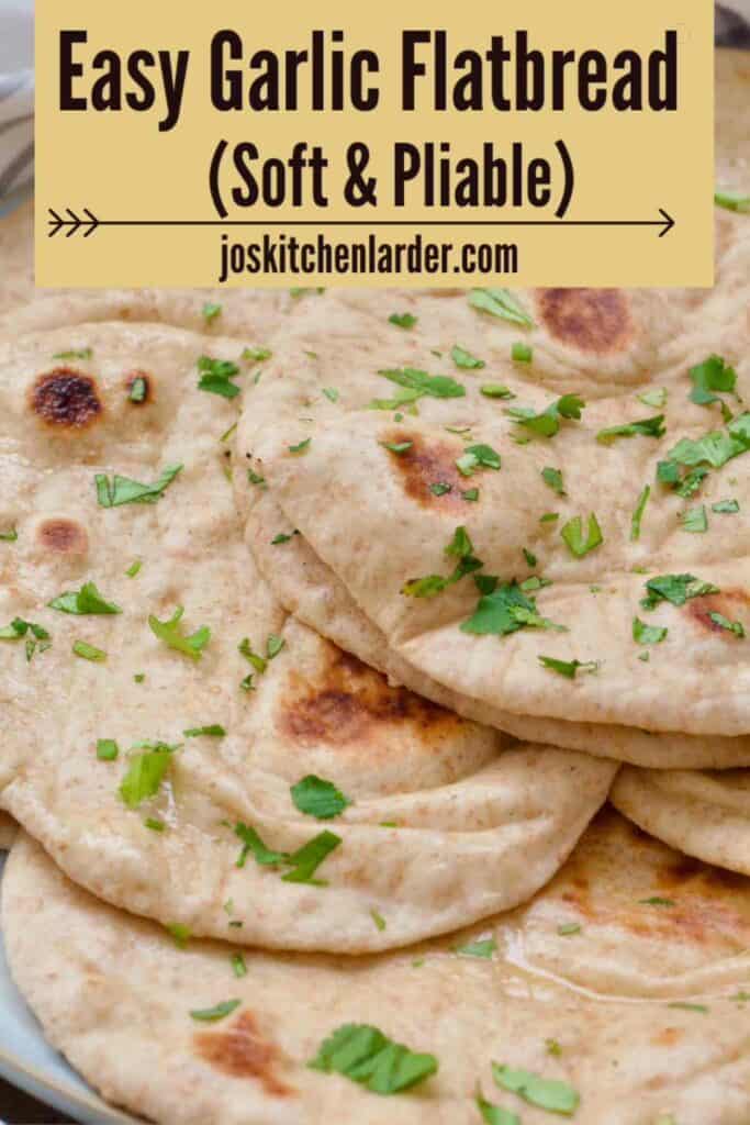 Flatbreads piled up together on a plate.