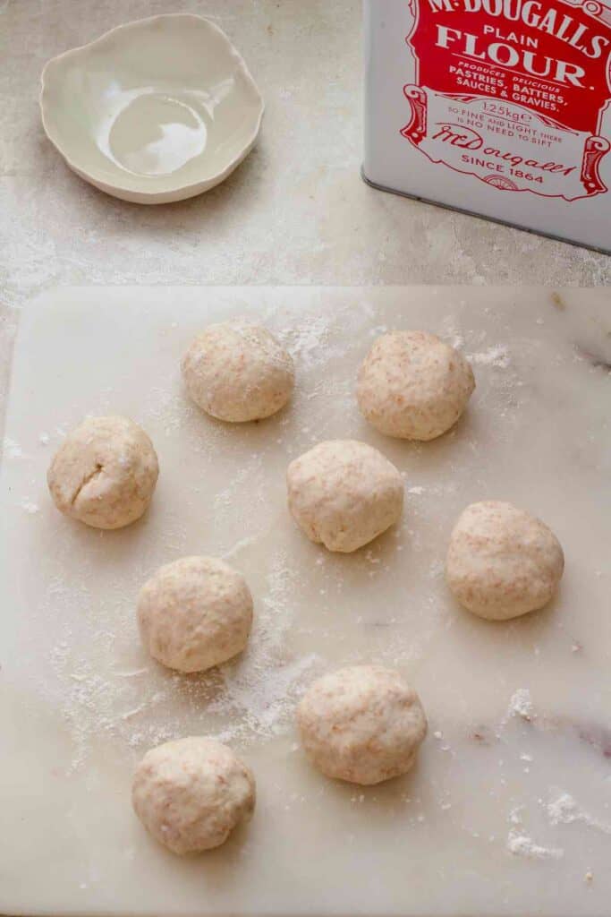 Flatbread dough divided into 8 equal size balls.