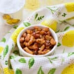 Pot with crispy beans and small pot with sea salt in the background.