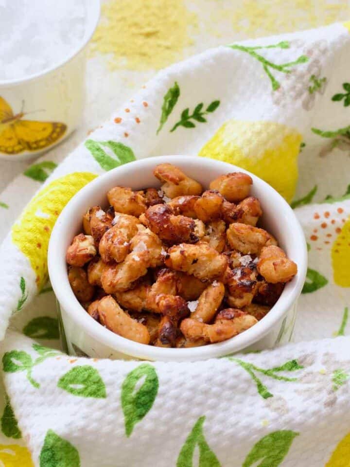 Pot with crispy beans and small pot with sea salt in the background.