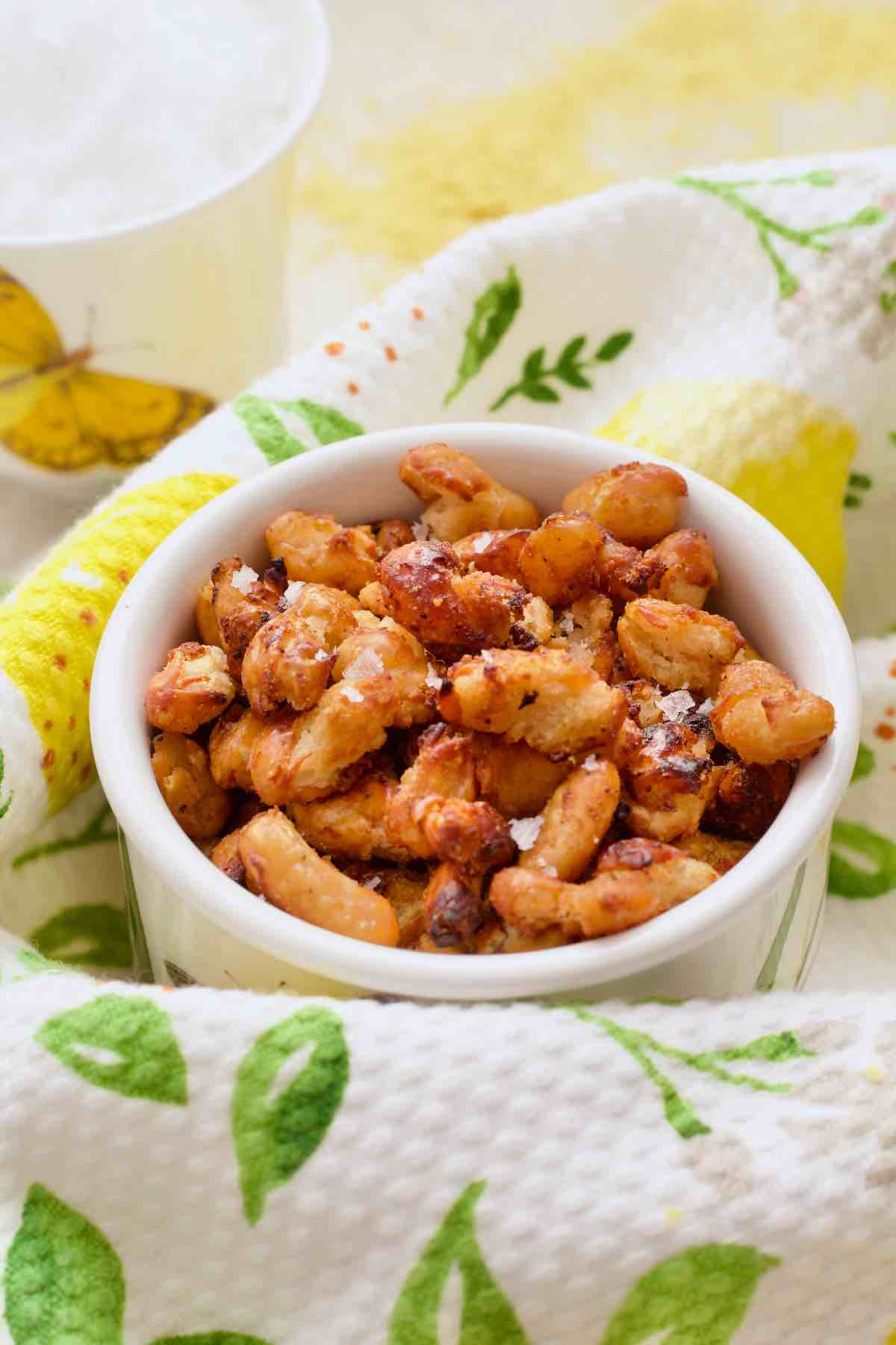 Small pot of crispy white beans wrapped in a kitchen towel.