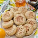 Plate piled up with crumpets.