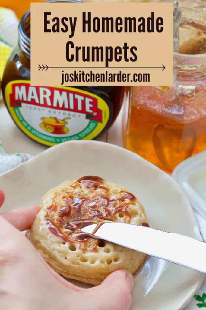 Spreading marmite on a crumpet.