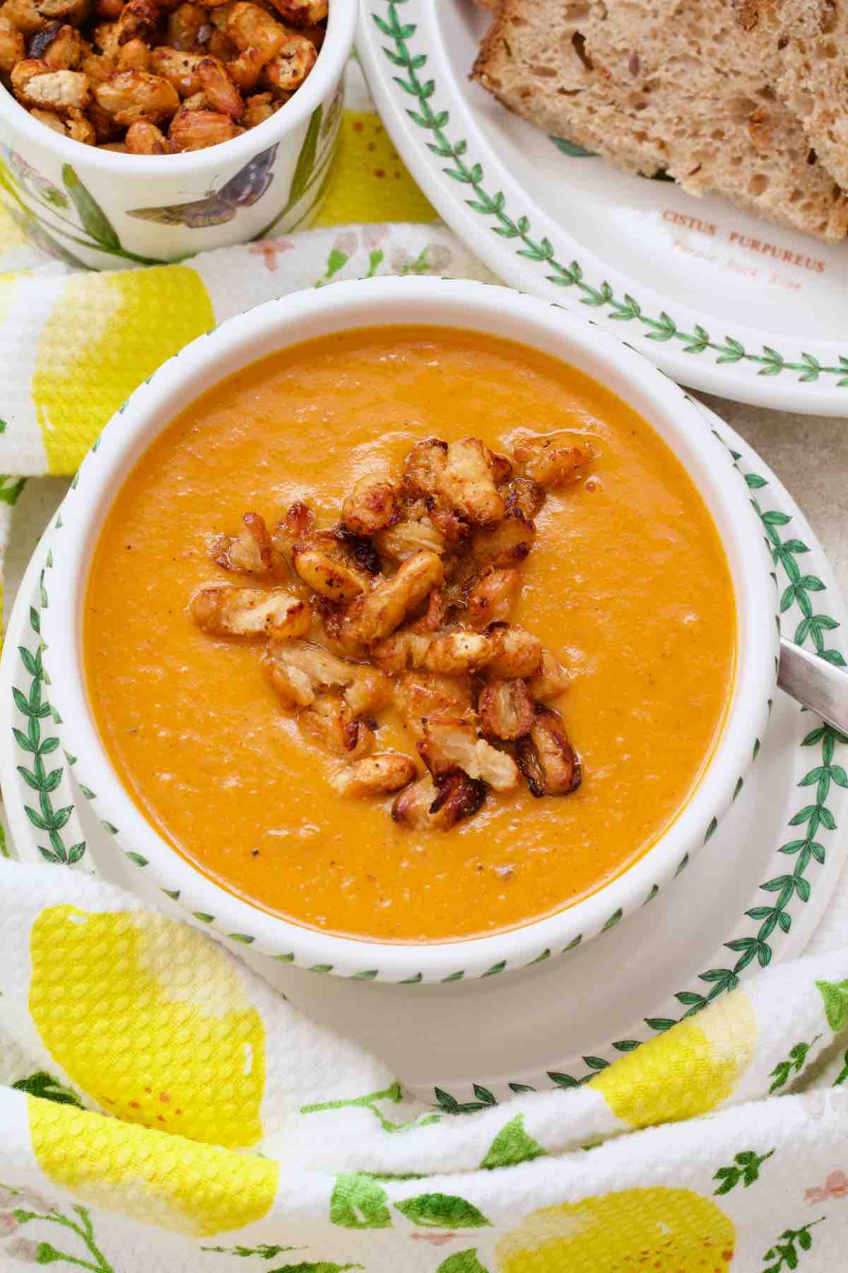 Serving of roasted tomato and sweet potato soup in a bowl.