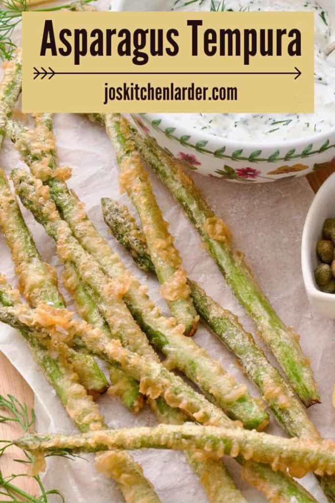 Asparagus tempura served on a parchment paper.