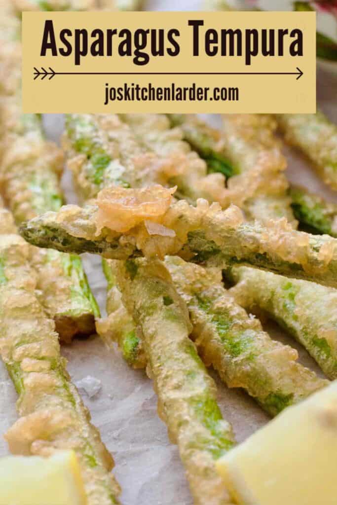 Close up of a deep fried battered tip of asparagus tempura.