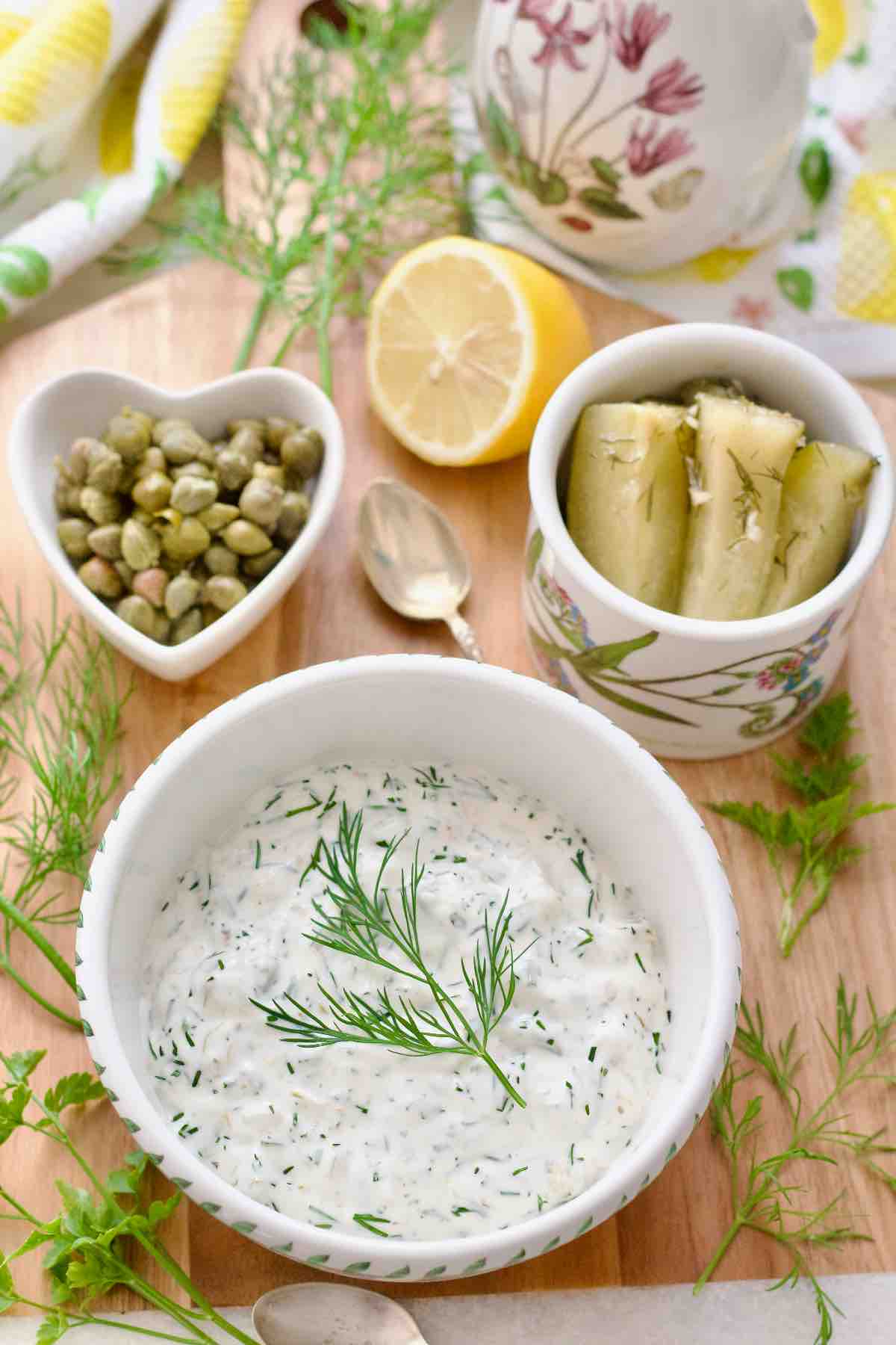 Bird eye view of tartare sauce in a bowl garnished with dill.