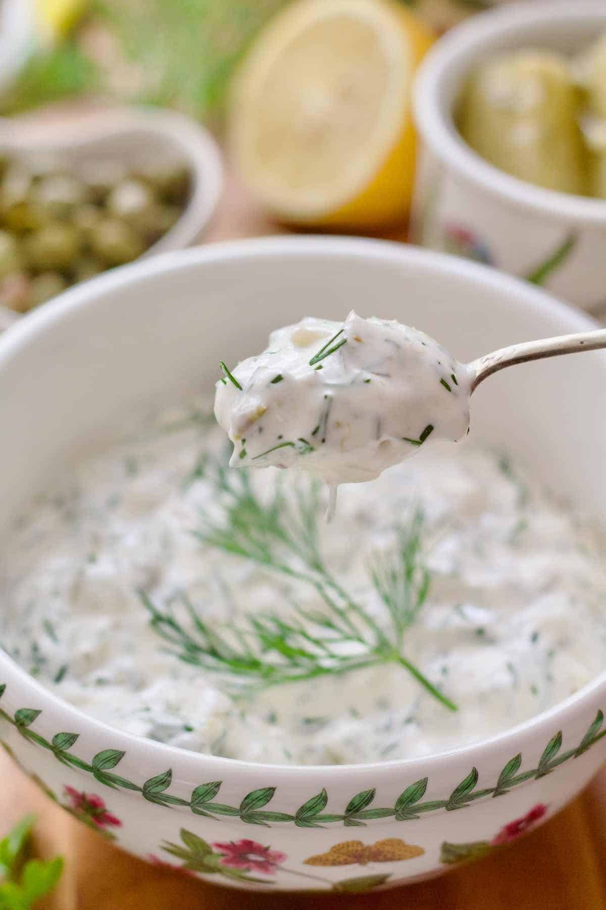 Close up of tartare sauce on a spoon.