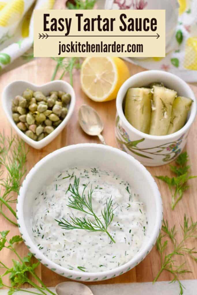 Bird eye view of tartare sauce in a bowl garnished with dill.