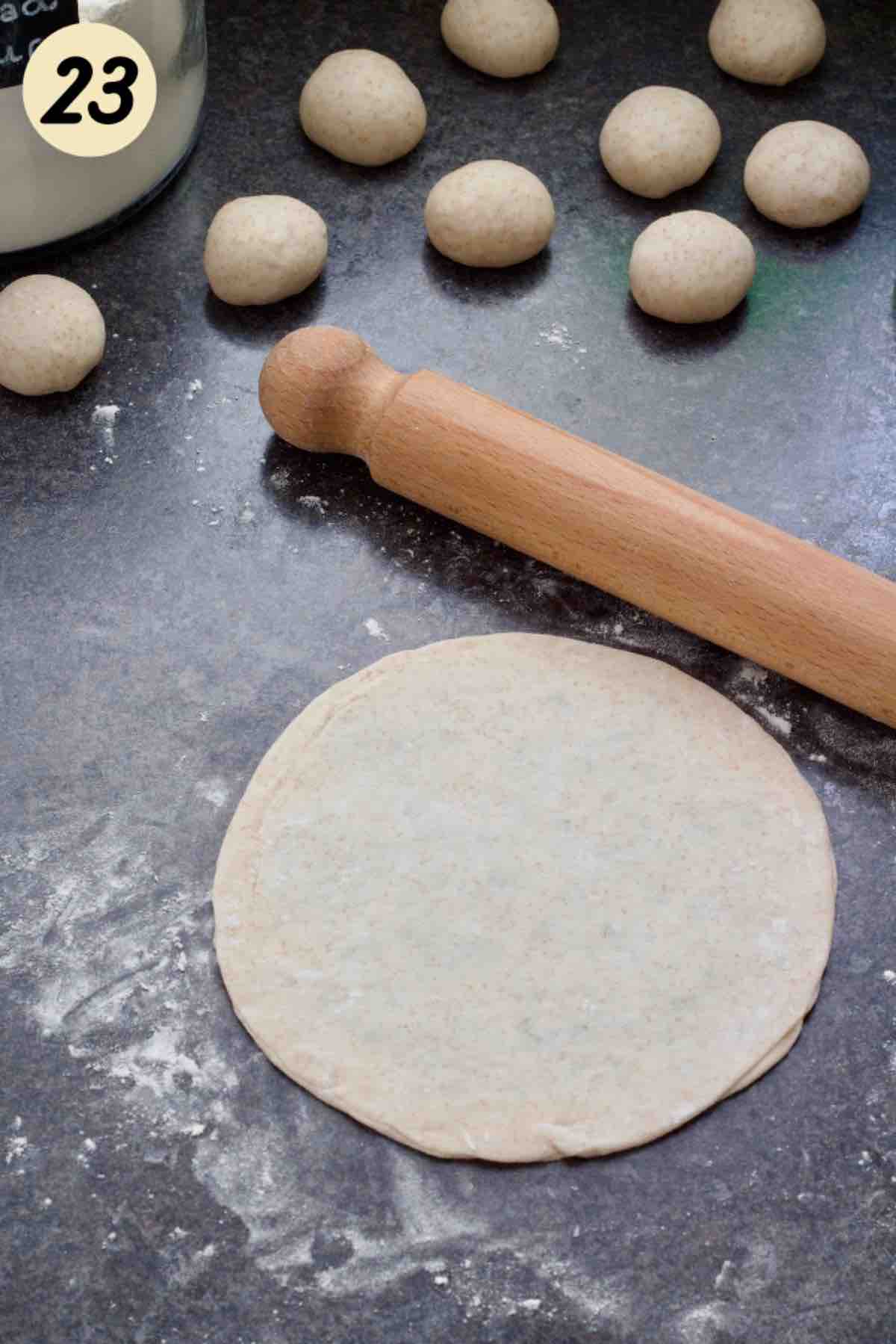 Rolled out paratha with filling inside ready for frying.