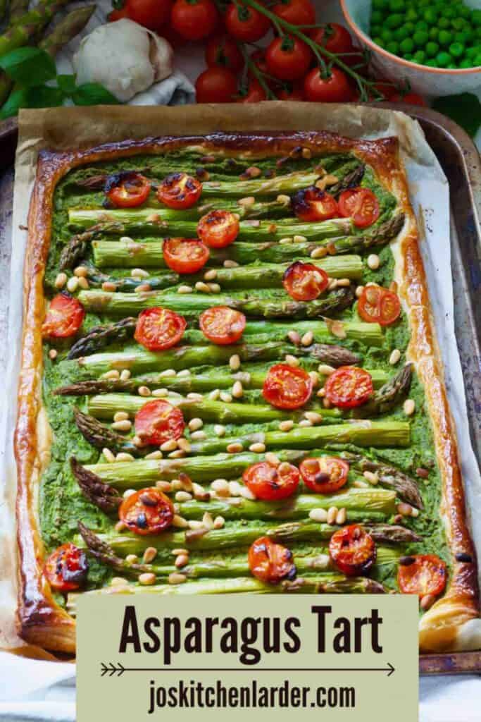 Whole asparagus tart on baking tray.