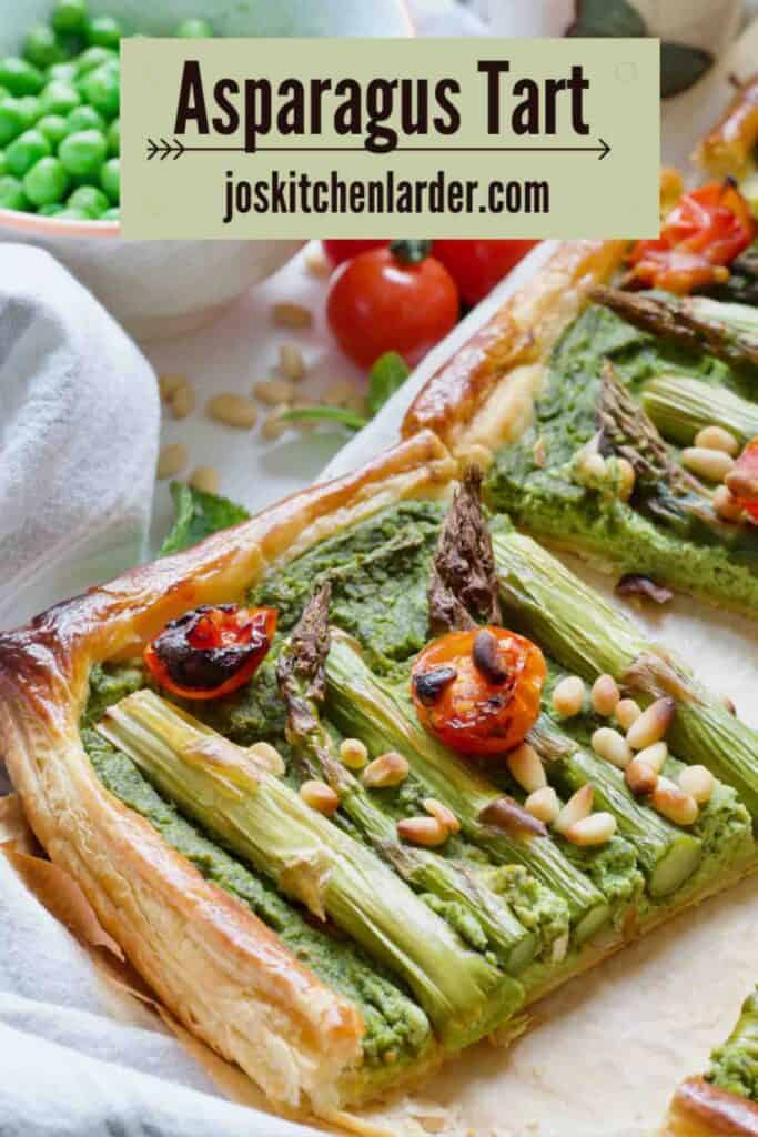 Asparagus tart square, peas in a bowl and cherry tomatoes.