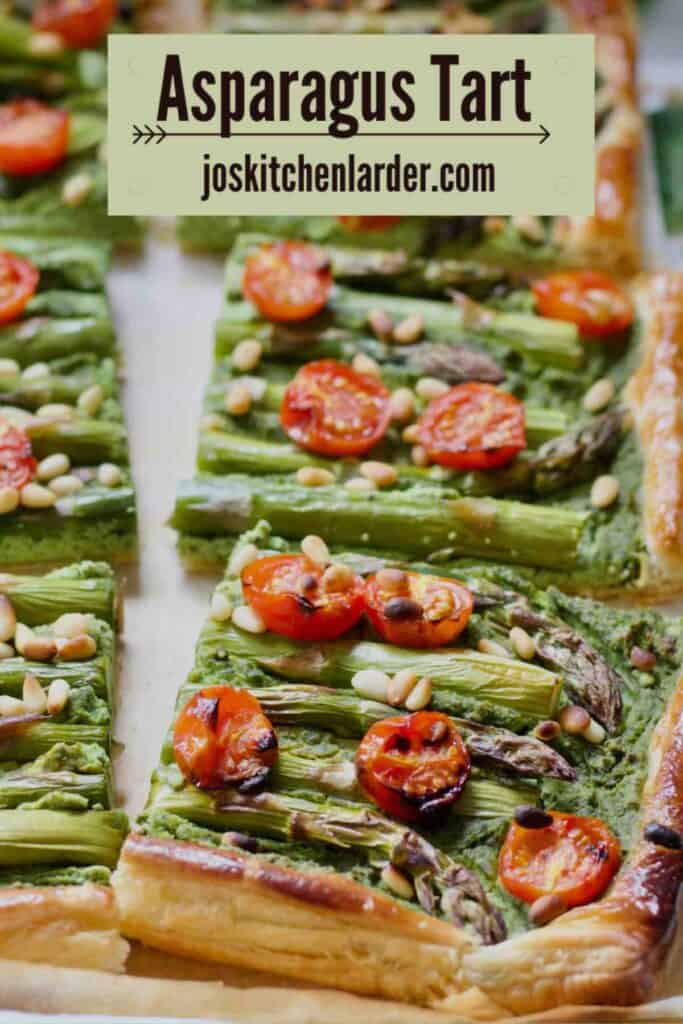 Asparagus tart cut into square sections.