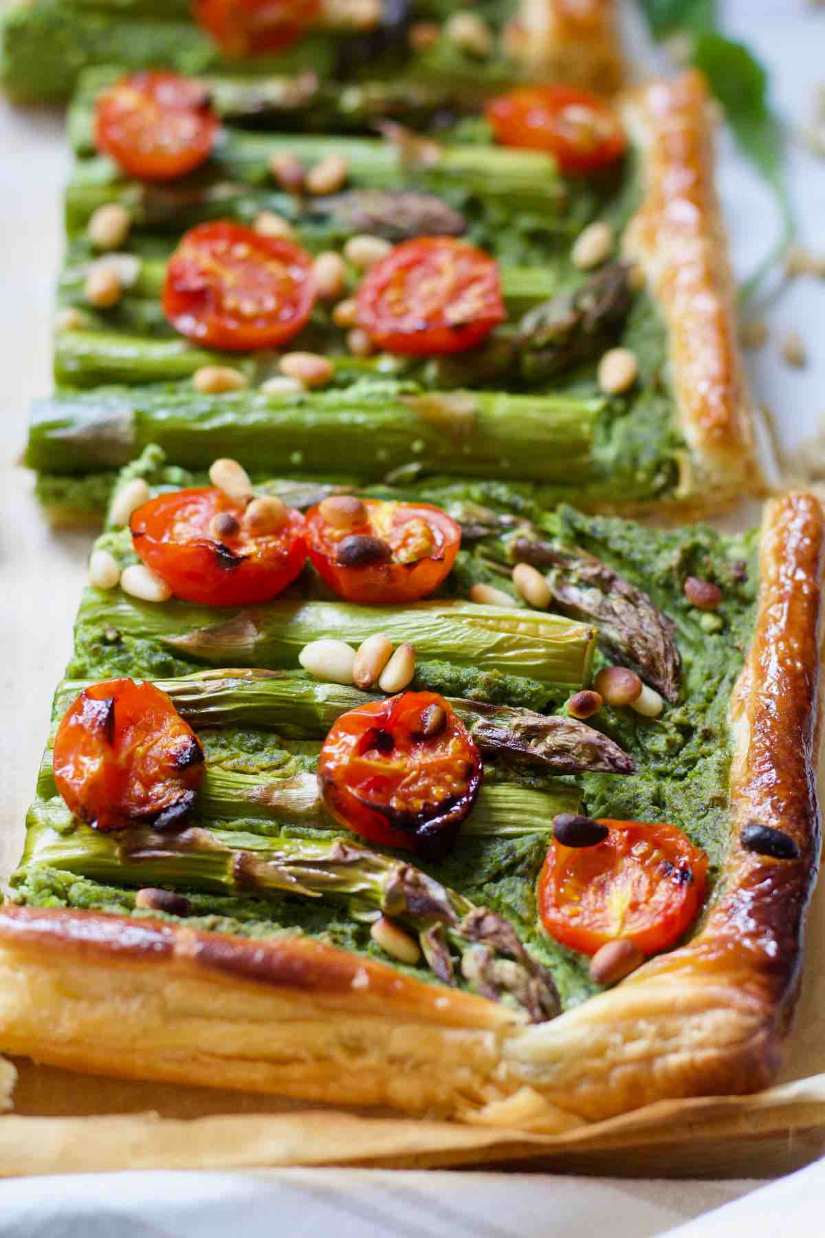 Square portion of asparagus tart close up.