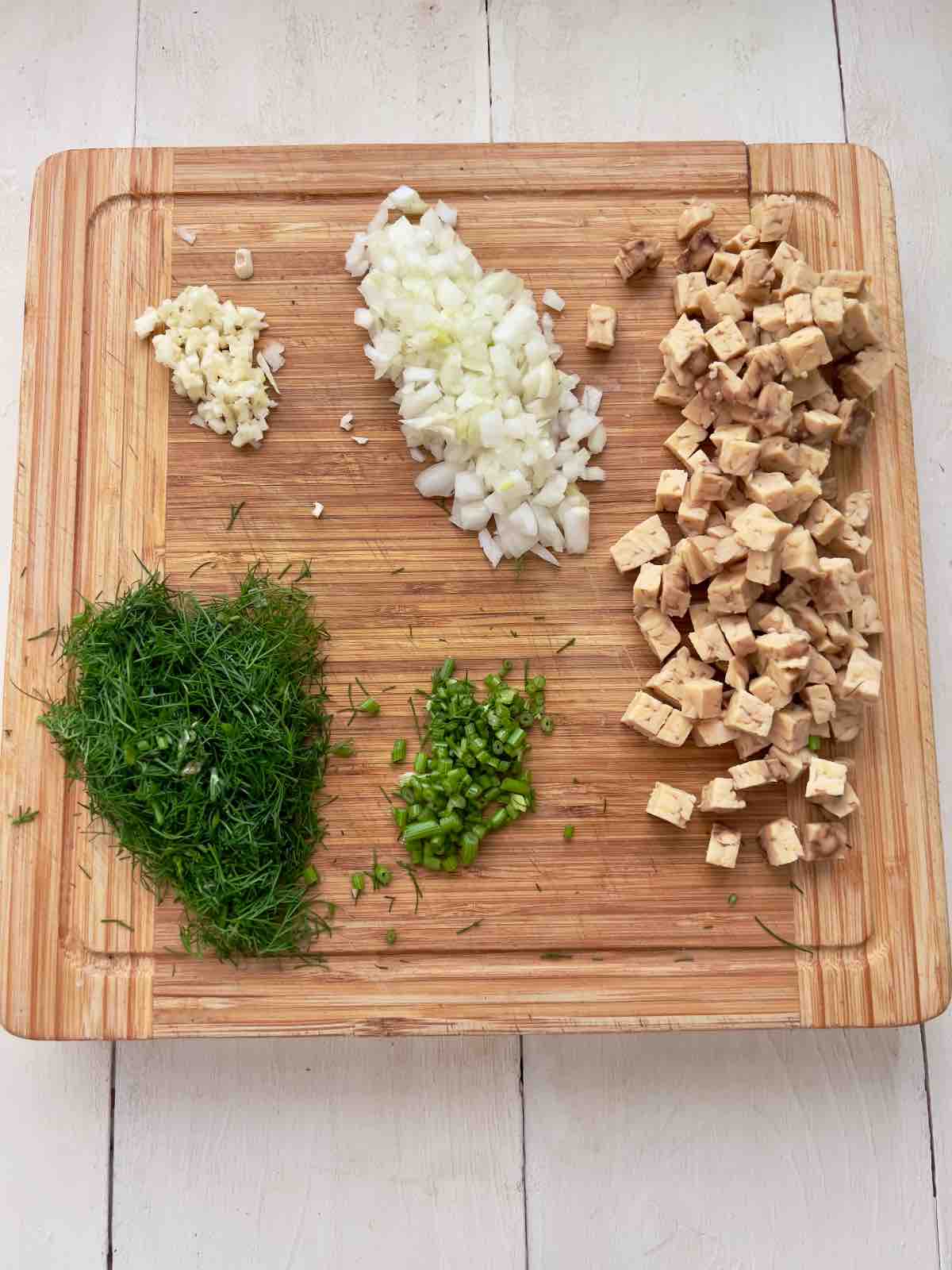 Prepared ingredients on a board ready for cooking.
