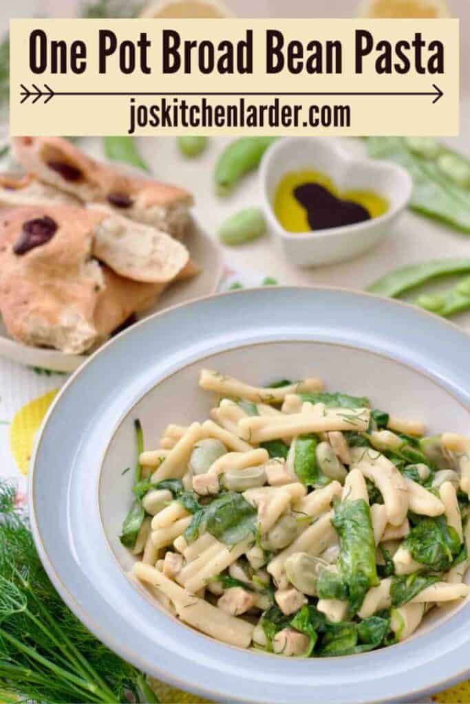 Portion of broad bean pasta in a bowl, bread and olive oil with vinegar for dipping.
