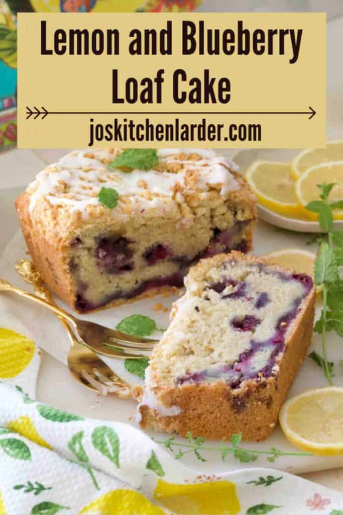 Slice of cake and end of loaf cake with forks and lemon slices.