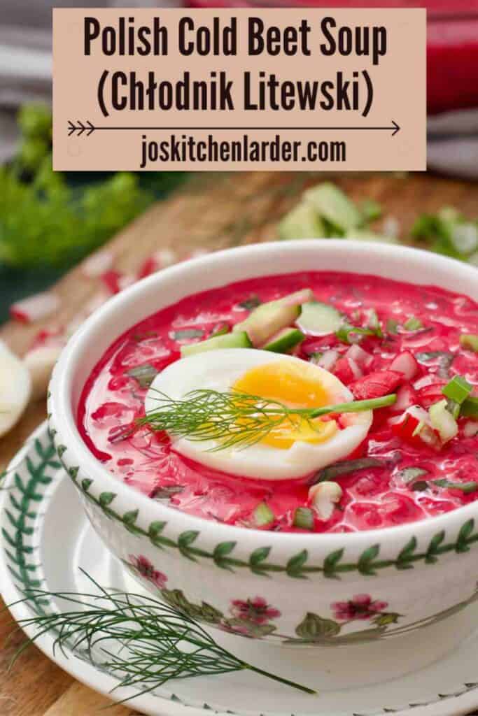 Chłodnik Litewski served in a small bowl, topped with jammy egg and a sprig of dill.