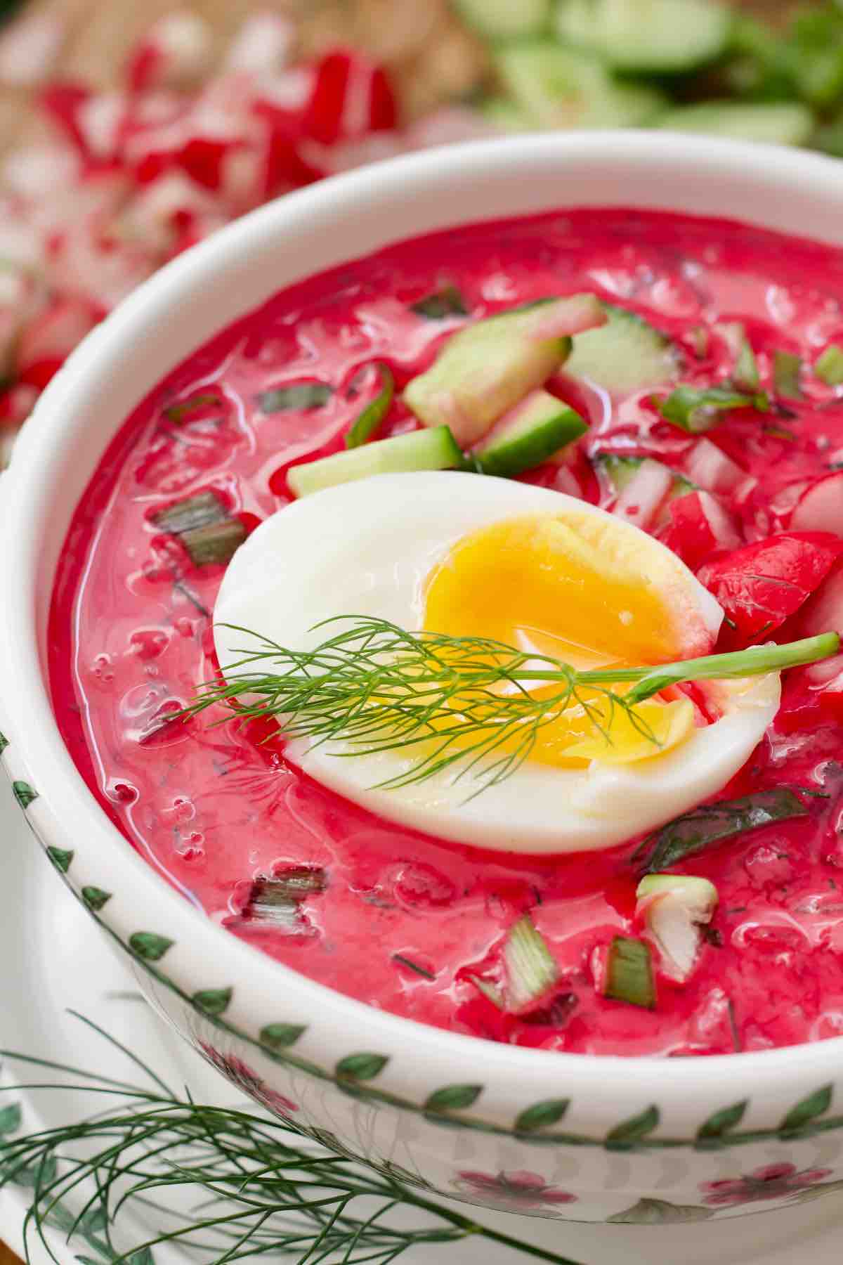 Close up of a jammy egg on top of chłodnik.