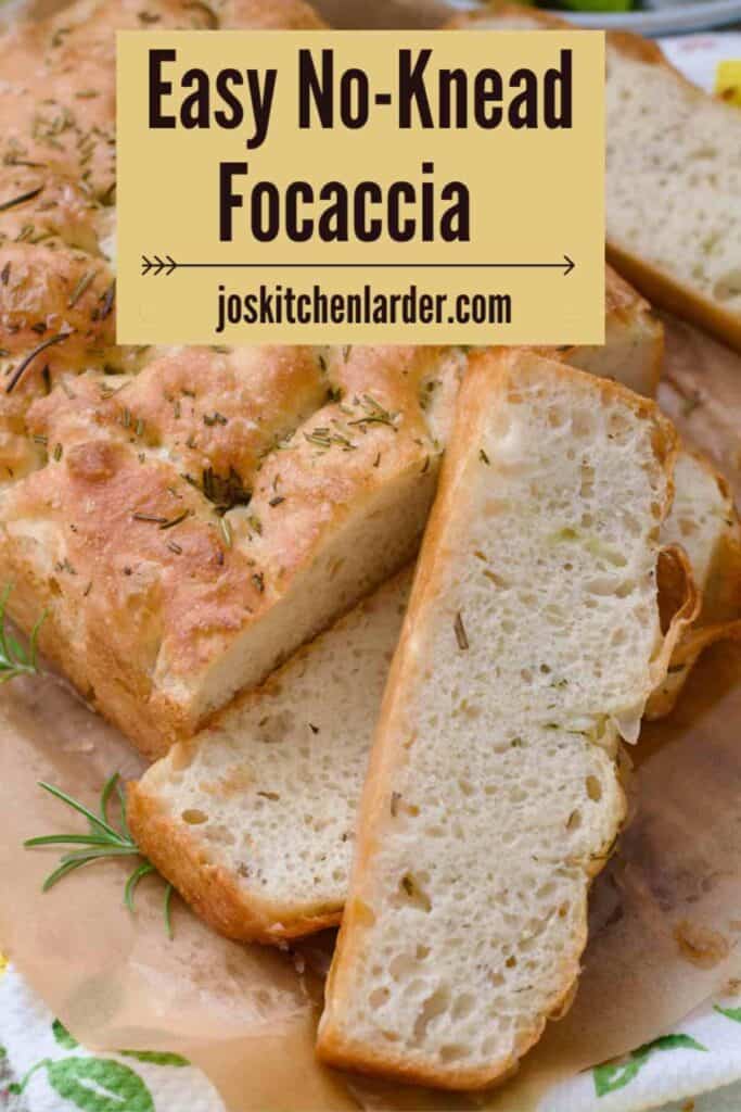 Bird view of focaccia with few slices already cut.