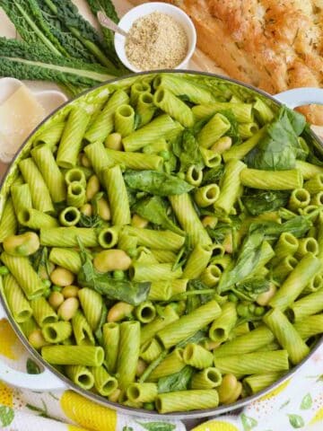 Green pasta in a casserole dish ready to serve.