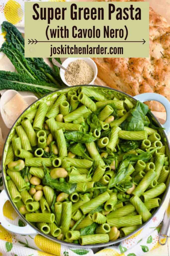 Casserole dish full of green pasta.